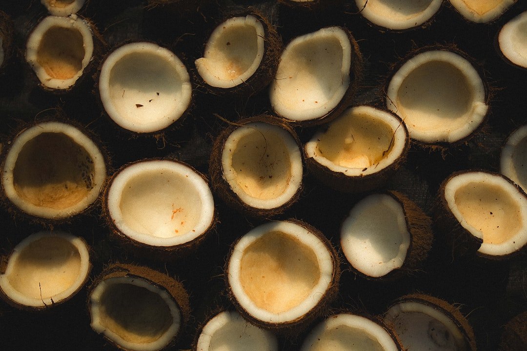 Overhead view of a cast iron skillet with black beans topped with baked eggs and melted cheese